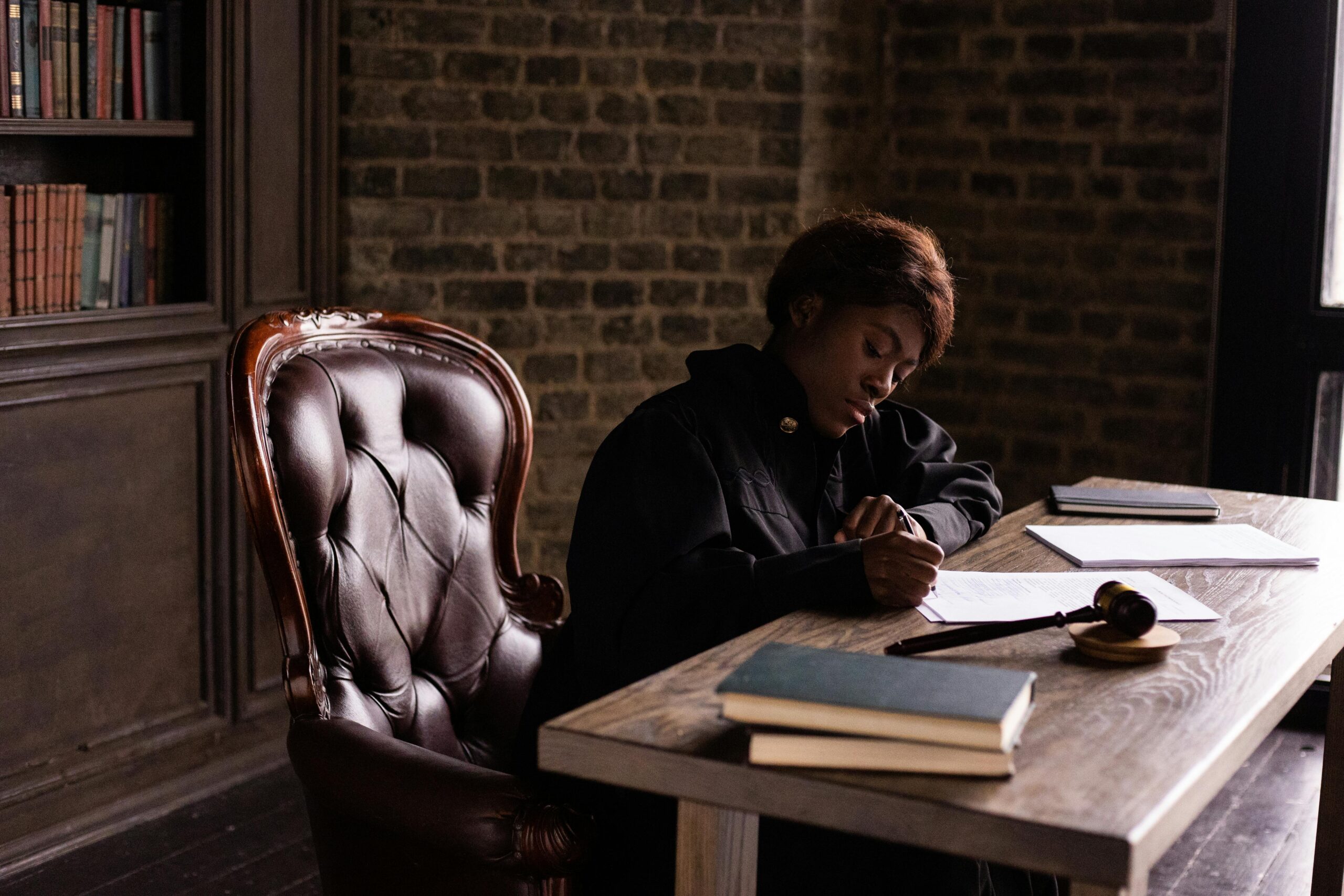 A woman is sitting in the office