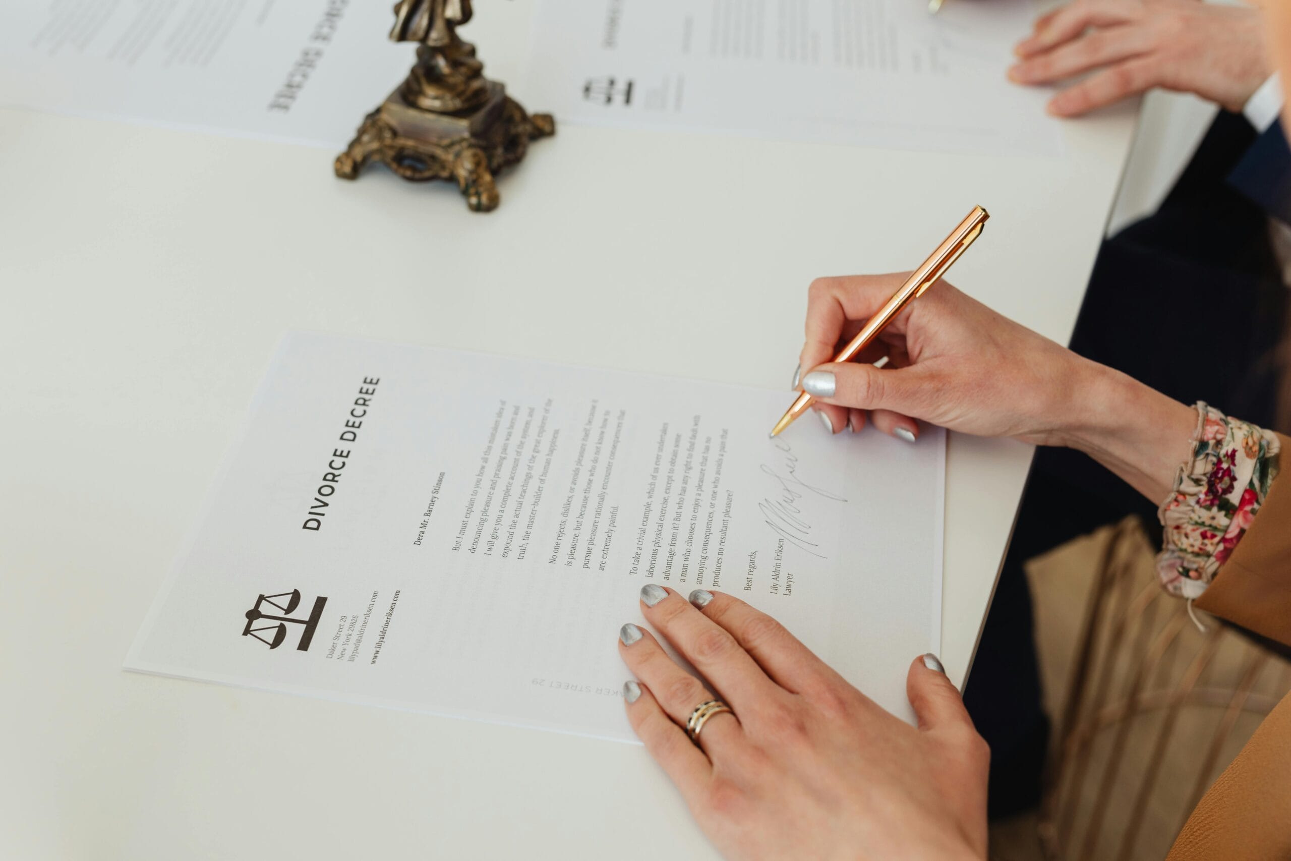 A girl signing the paper