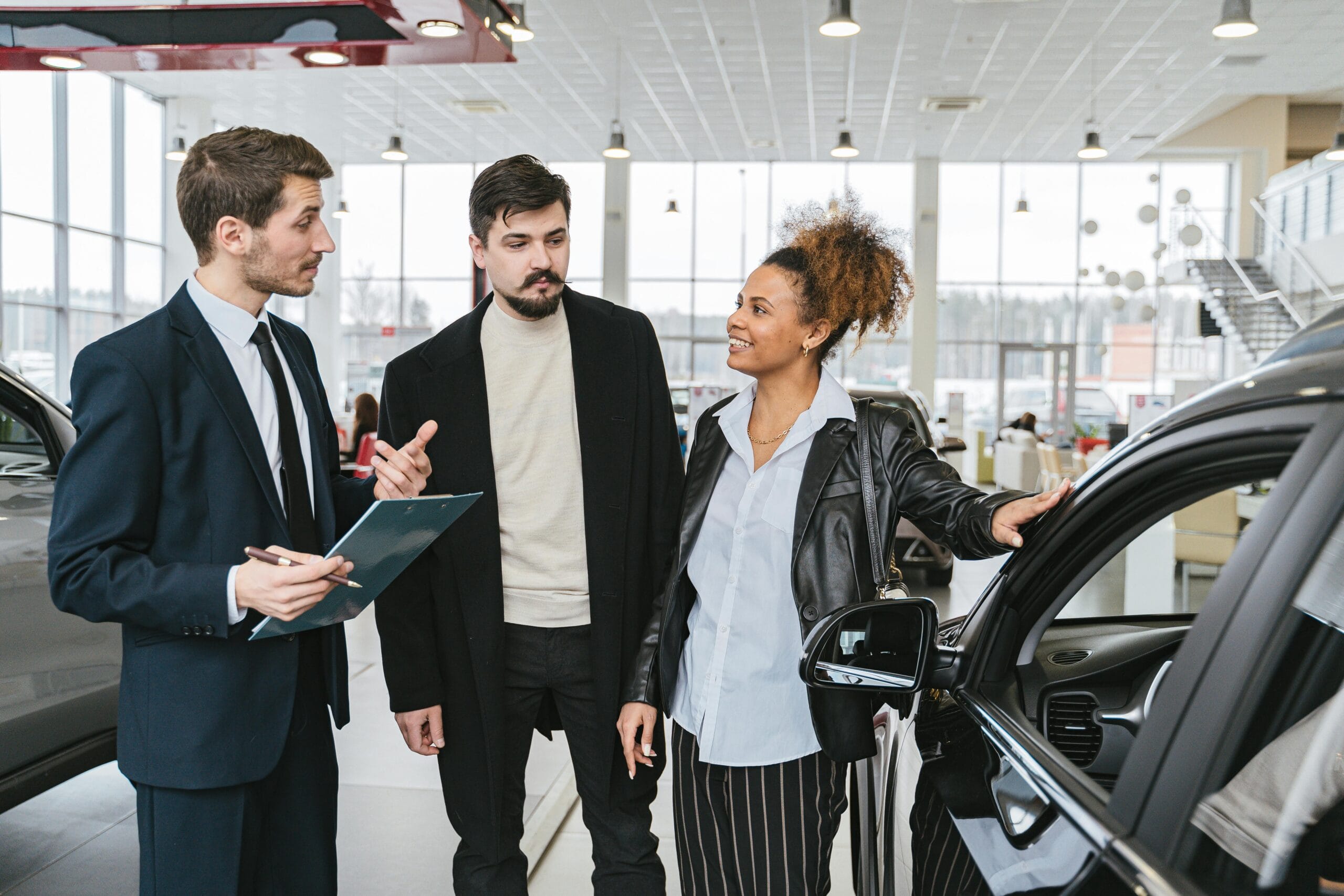 3 people with a car