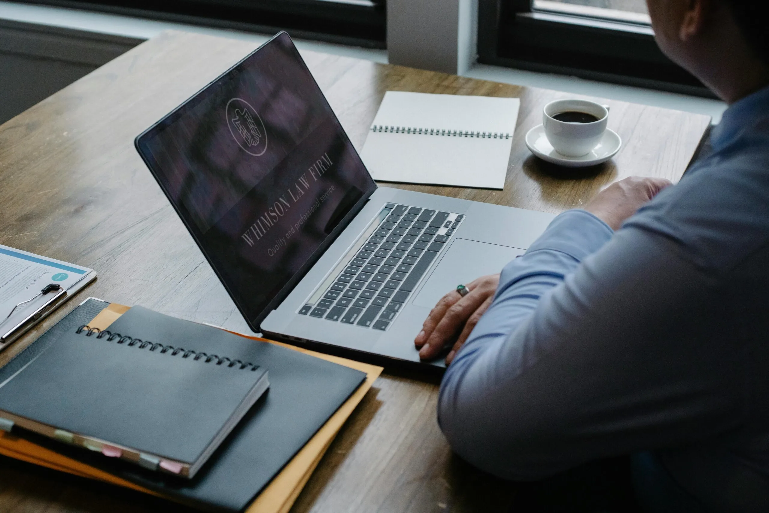 A man with laptop, sitting in the office